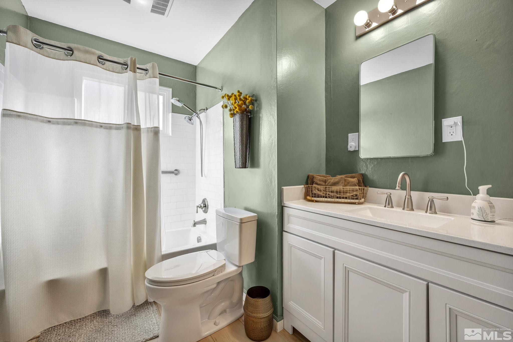 770 Rhode Island Drive Reno, NV 89503 - Photo 9 of 19 a bathroom with a sink toilet and shower