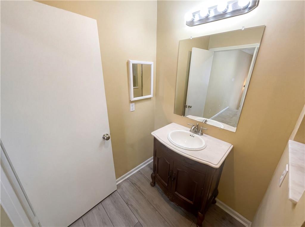 27 Chaumont Square Northwest Atlanta, GA 30327 - Photo 15 of 21 a bathroom with a sink and a mirror