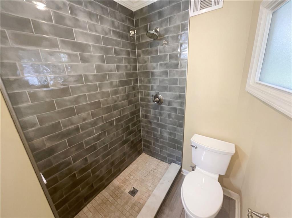27 Chaumont Square Northwest Atlanta, GA 30327 - Photo 17 of 21 a bathroom with a toilet and a shower