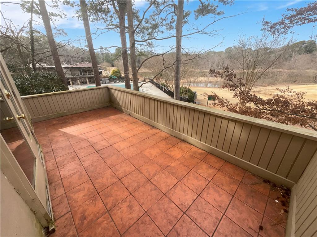 27 Chaumont Square Northwest Atlanta, GA 30327 - Photo 19 of 21 a view of a balcony with trees