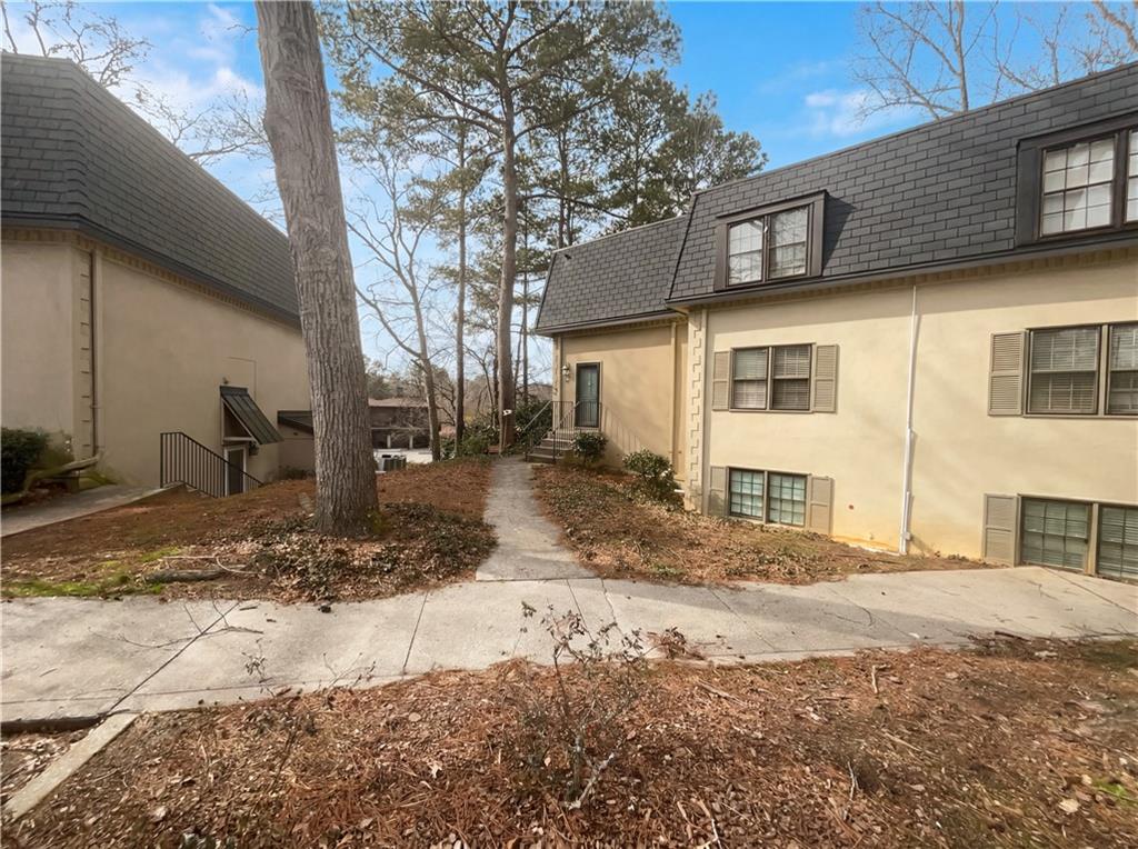 27 Chaumont Square Northwest Atlanta, GA 30327 - Photo 2 of 21 a front view of a house with a yard