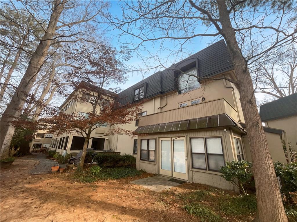 27 Chaumont Square Northwest Atlanta, GA 30327 - Photo 21 of 21 a house with trees in front of it