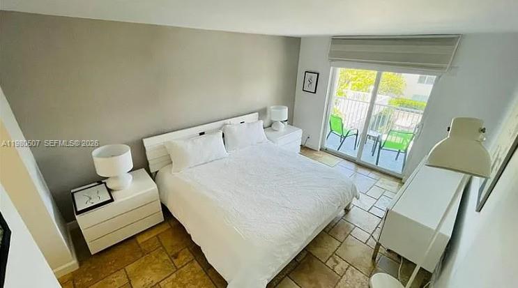 240 Galen Drive, Unit 314 Key Biscayne, FL 33149 - Photo 2 of 10 a bed sitting in a bedroom next to a window
