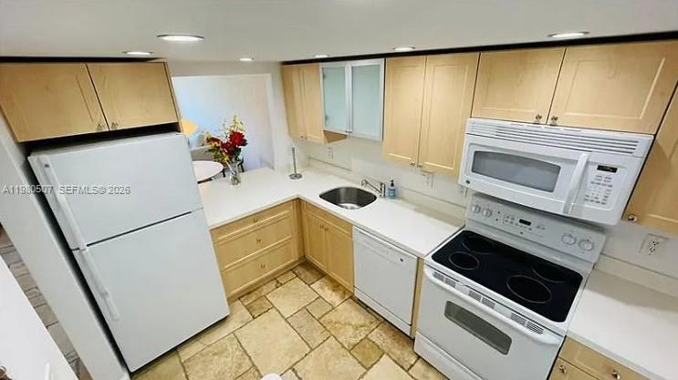 240 Galen Drive, Unit 314 Key Biscayne, FL 33149 - Photo 7 of 10 a kitchen with a sink cabinets and appliances
