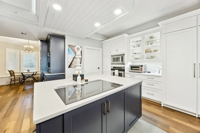 a kitchen with granite countertop a sink and cabinets
