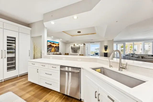 a kitchen with stainless steel appliances granite countertop a sink and stove top oven