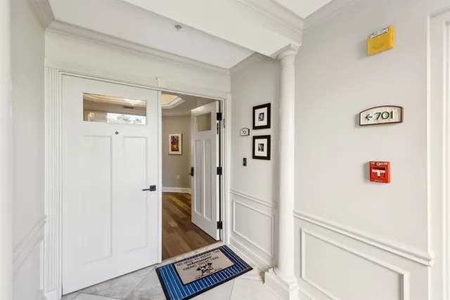 a view of an entryway with wooden floor