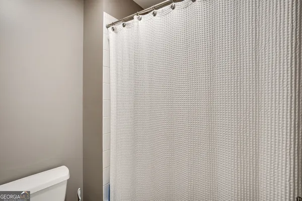 a bedroom with furniture and a chandelier