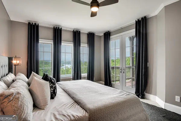 a view of a porch with furniture and garden