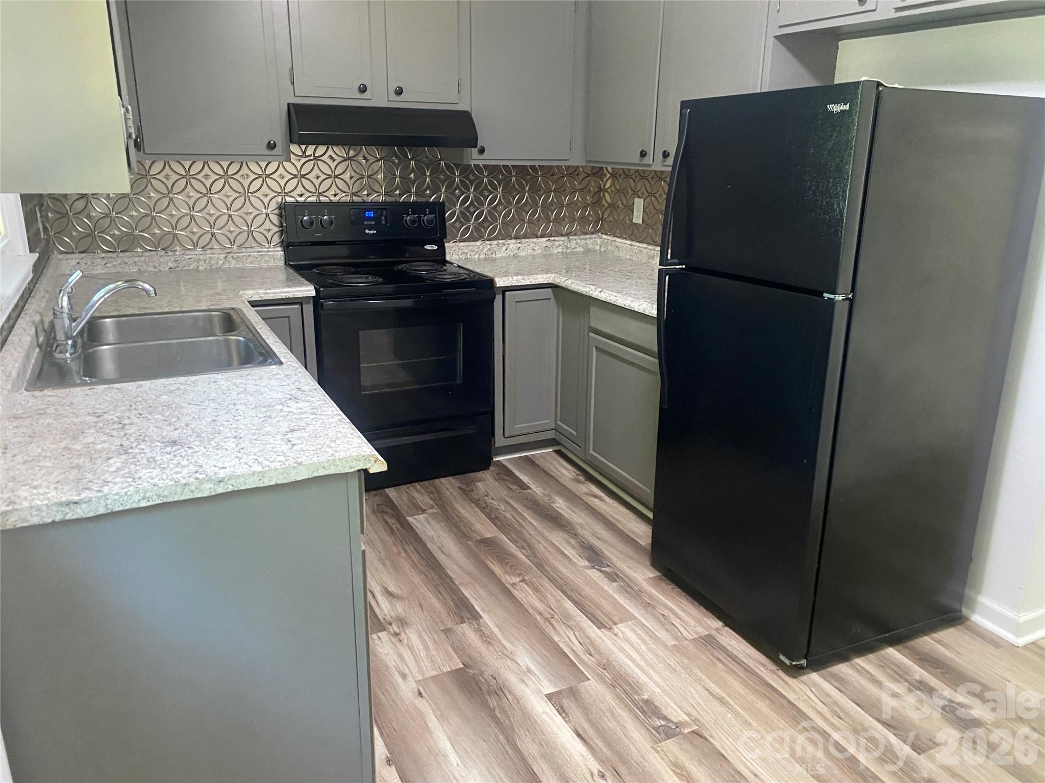 788 Coley Road Salisbury, NC 28146 - Photo 12 of 43 a kitchen with a refrigerator and a sink