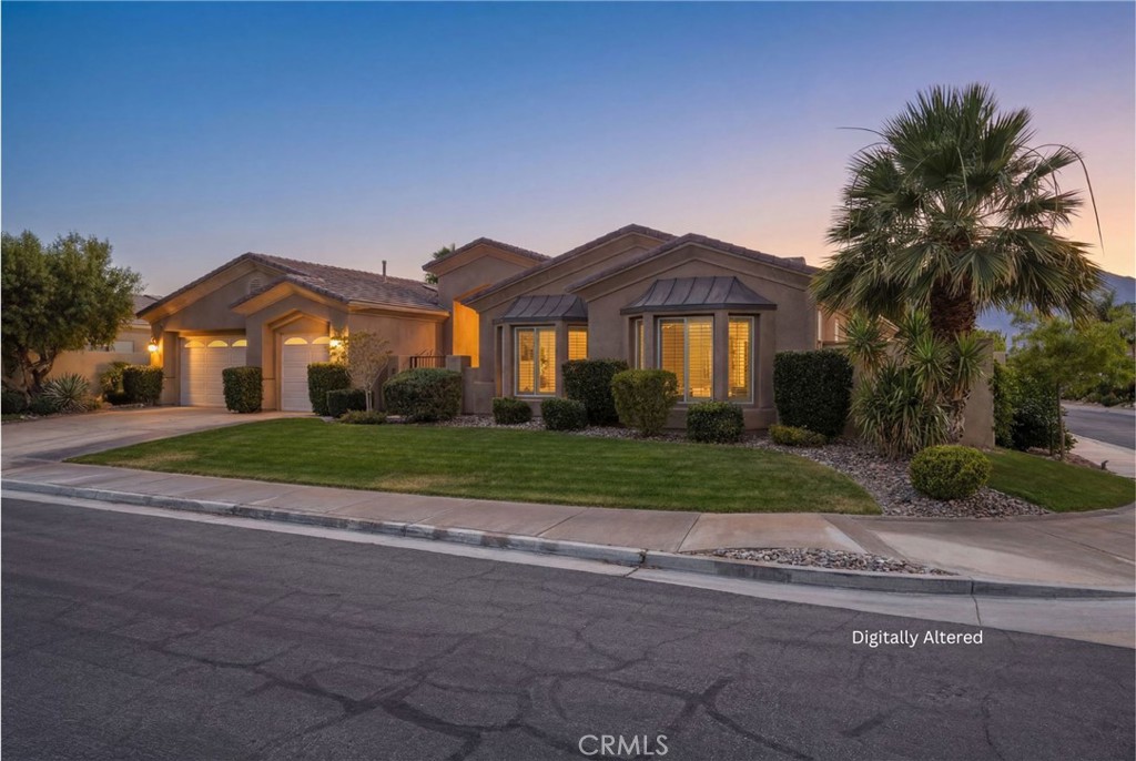 9 Orleans Road Rancho Mirage, CA 92270 - Photo 5 of 71 a front view of house with yard and green space