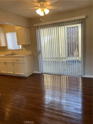 a view of a room with wooden floor