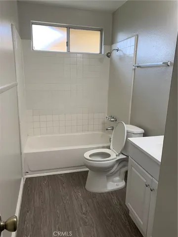 a bathroom with a toilet a sink and bathtub