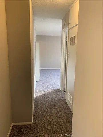 a view of a room with a hallway