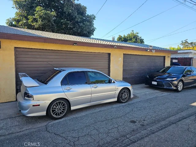 a car parked in front of a garage