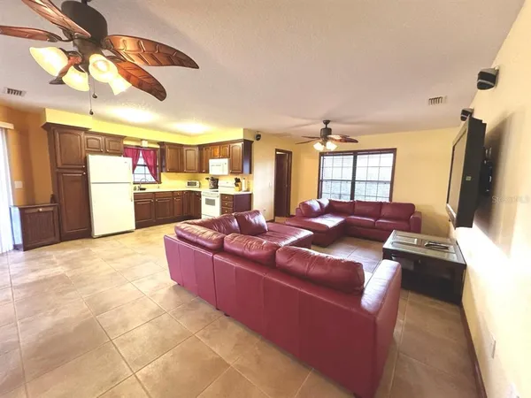 a kitchen with stainless steel appliances granite countertop a refrigerator stove a sink dishwasher and a refrigerator