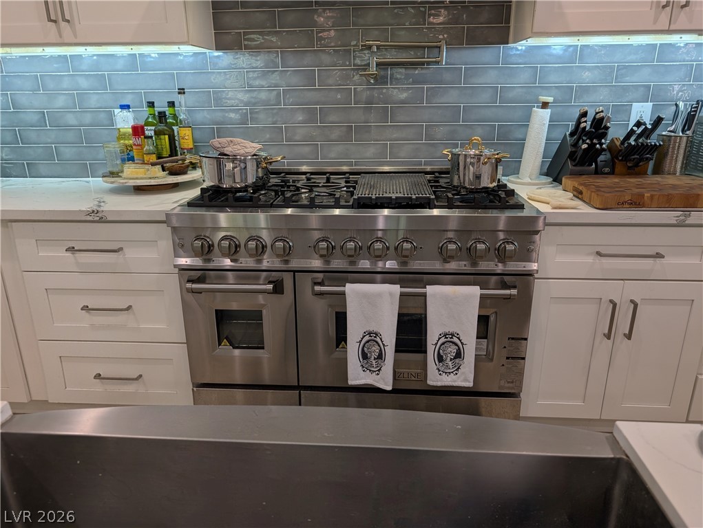 251 Spring Heights Caliente, NV 89008 - Photo 11 of 27 This chef's kitchen features high-end appliances, sleek cabinetry, and ample counter space.