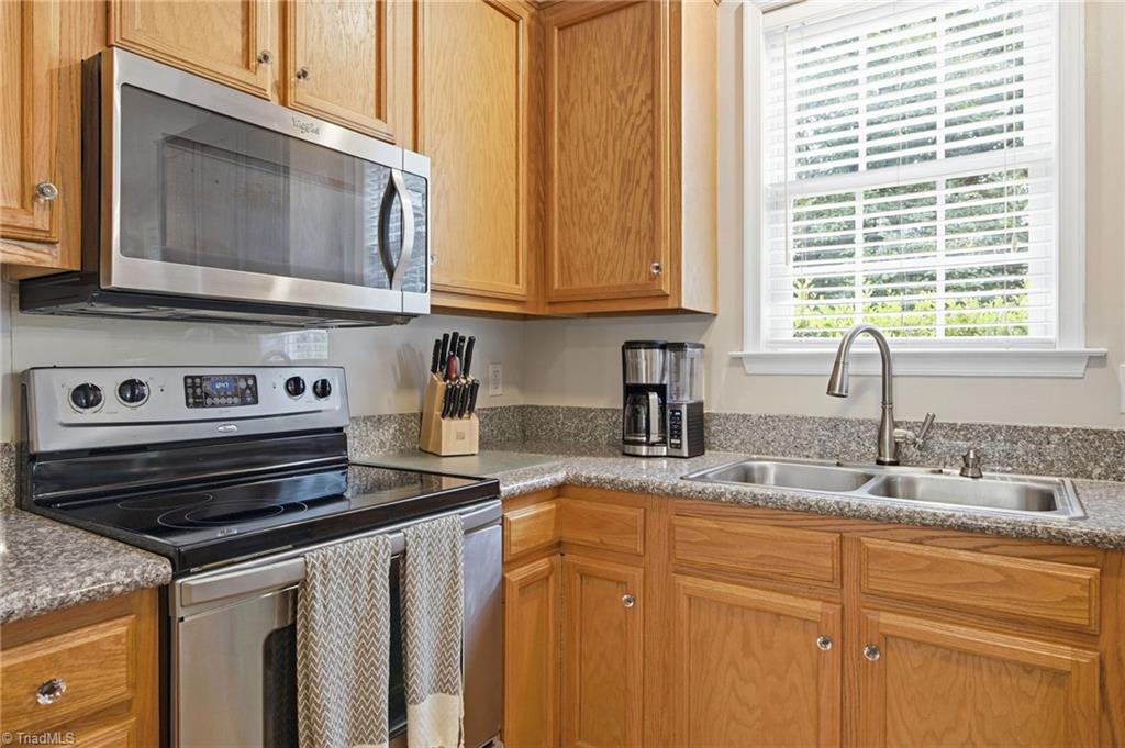 3659 Canopy Oak Court High Point, NC 27265 - Photo 19 of 42 Kitchen with granite countertops, double bowl sink and lots of cabinet storages.