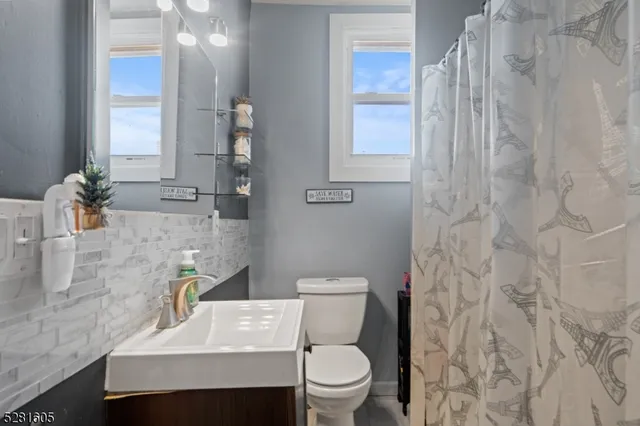 a view of a hallway with seating area