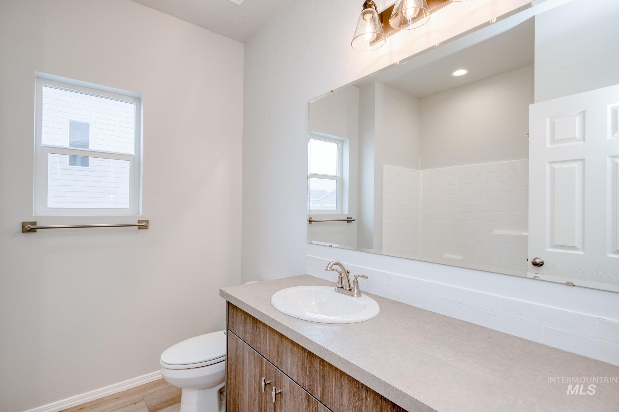 13740 Judson Street Caldwell, ID 83607 - Photo 12 of 23 Bathroom featuring vanity and light wood-style floors