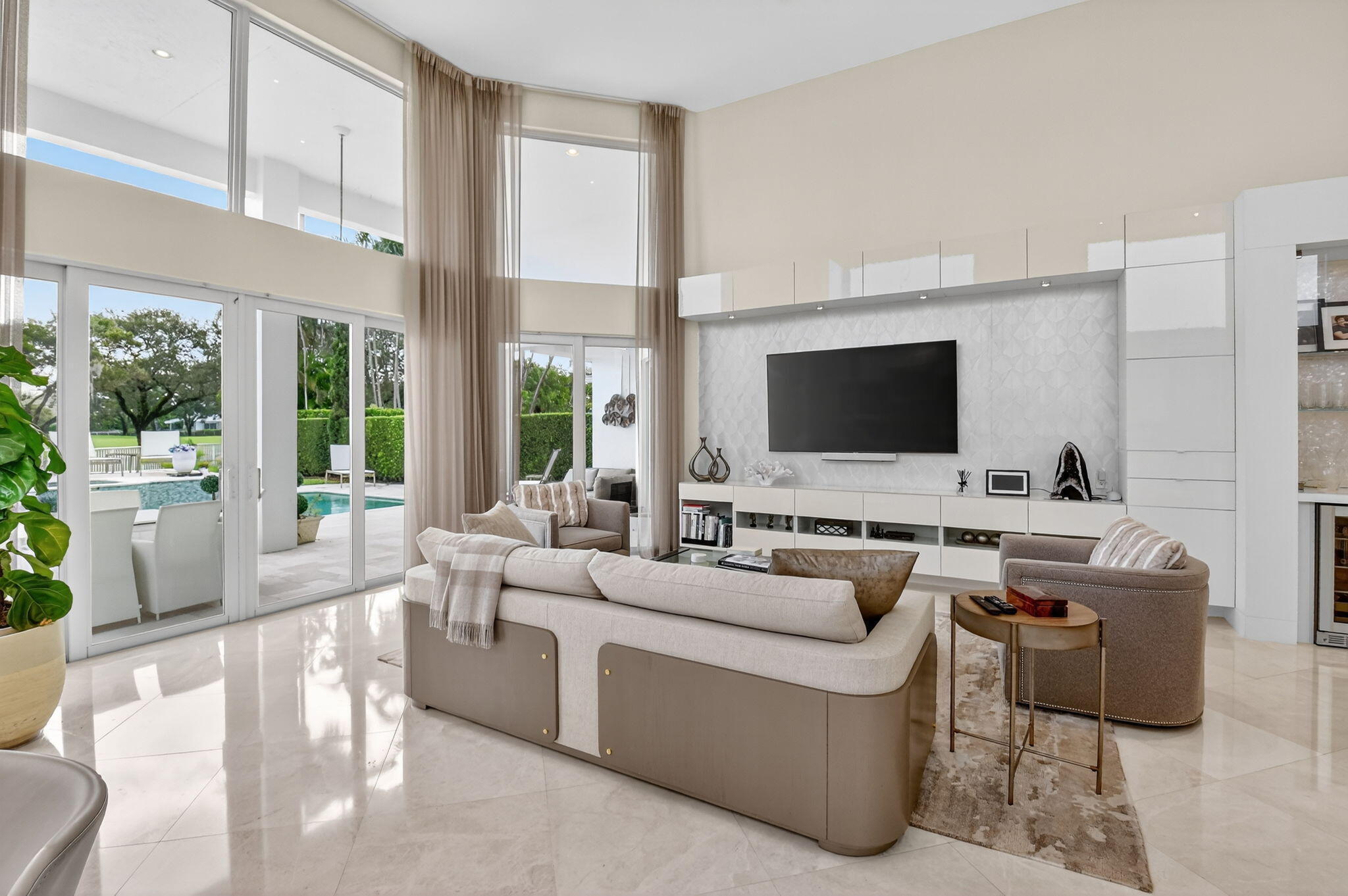 2563 Northwest 63rd Street Boca Raton, FL 33496 - Photo 21 of 65 a living room with furniture and a flat screen tv