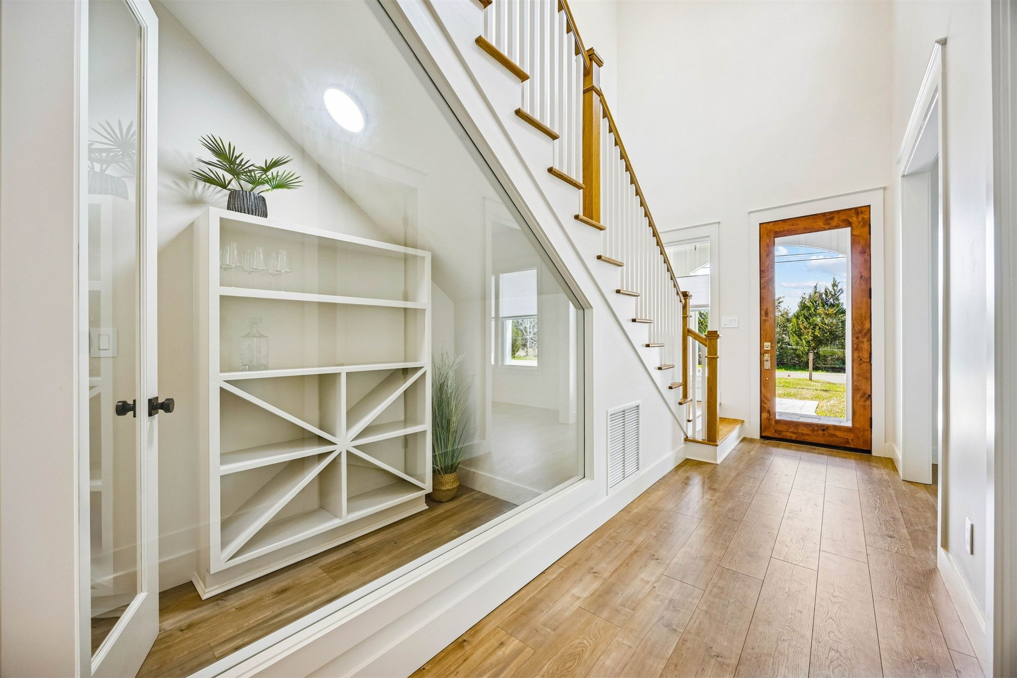 424 South 3rd Street Fernandina Beach, FL 32034 - Photo 3 of 38 a view of an entryway with wooden floor door and windows
