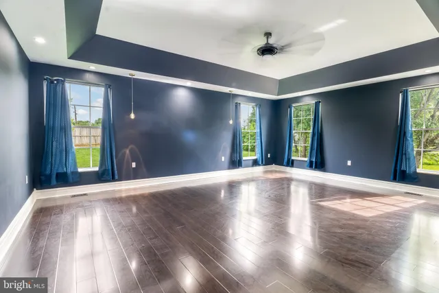 a large kitchen with stainless steel appliances a large counter top
