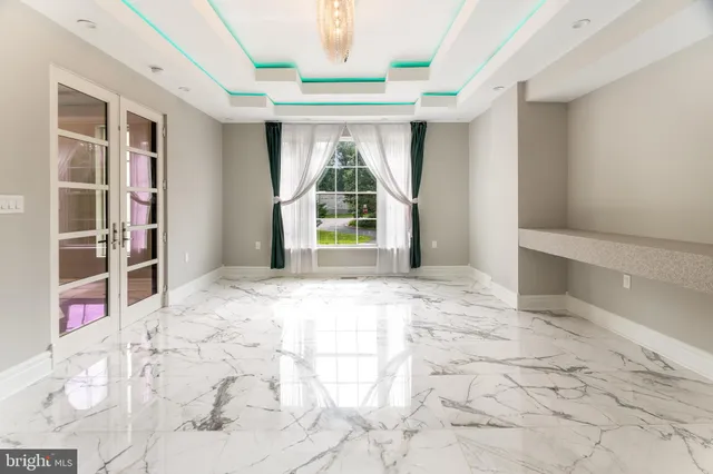 a kitchen with stainless steel appliances kitchen island granite countertop a stove a sink and a microwave