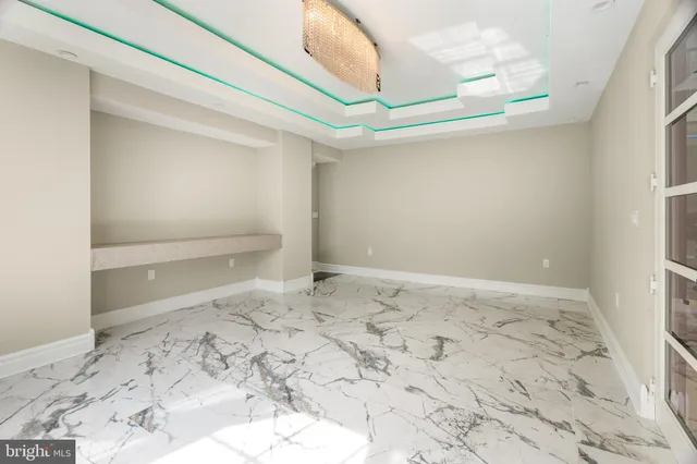 a kitchen with stainless steel appliances kitchen island granite countertop a stove and a sink