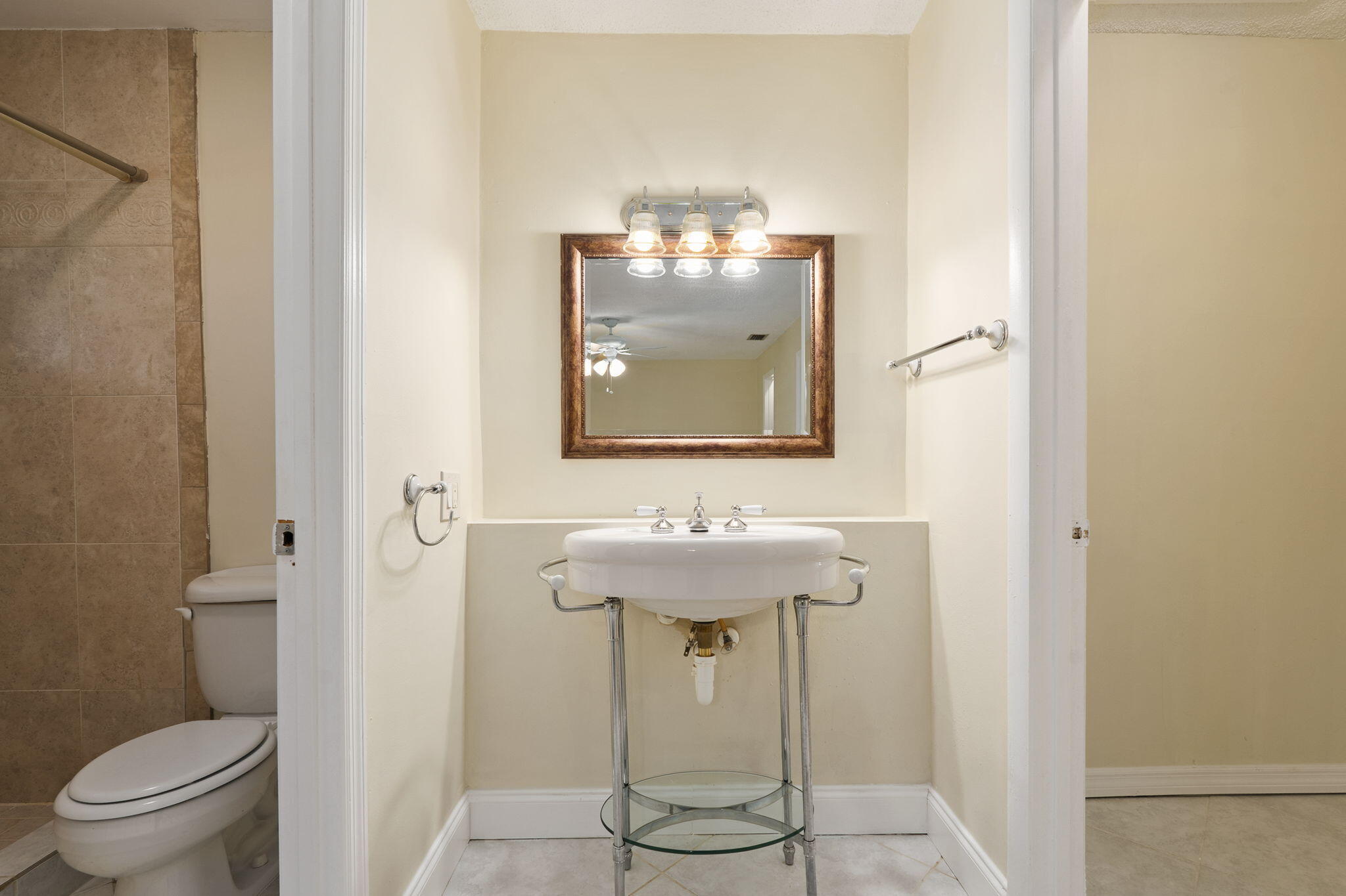 311 Colony Lane, Unit C Fort Pierce, FL 34982 - Photo 13 of 24 a bathroom with a sink and toilet