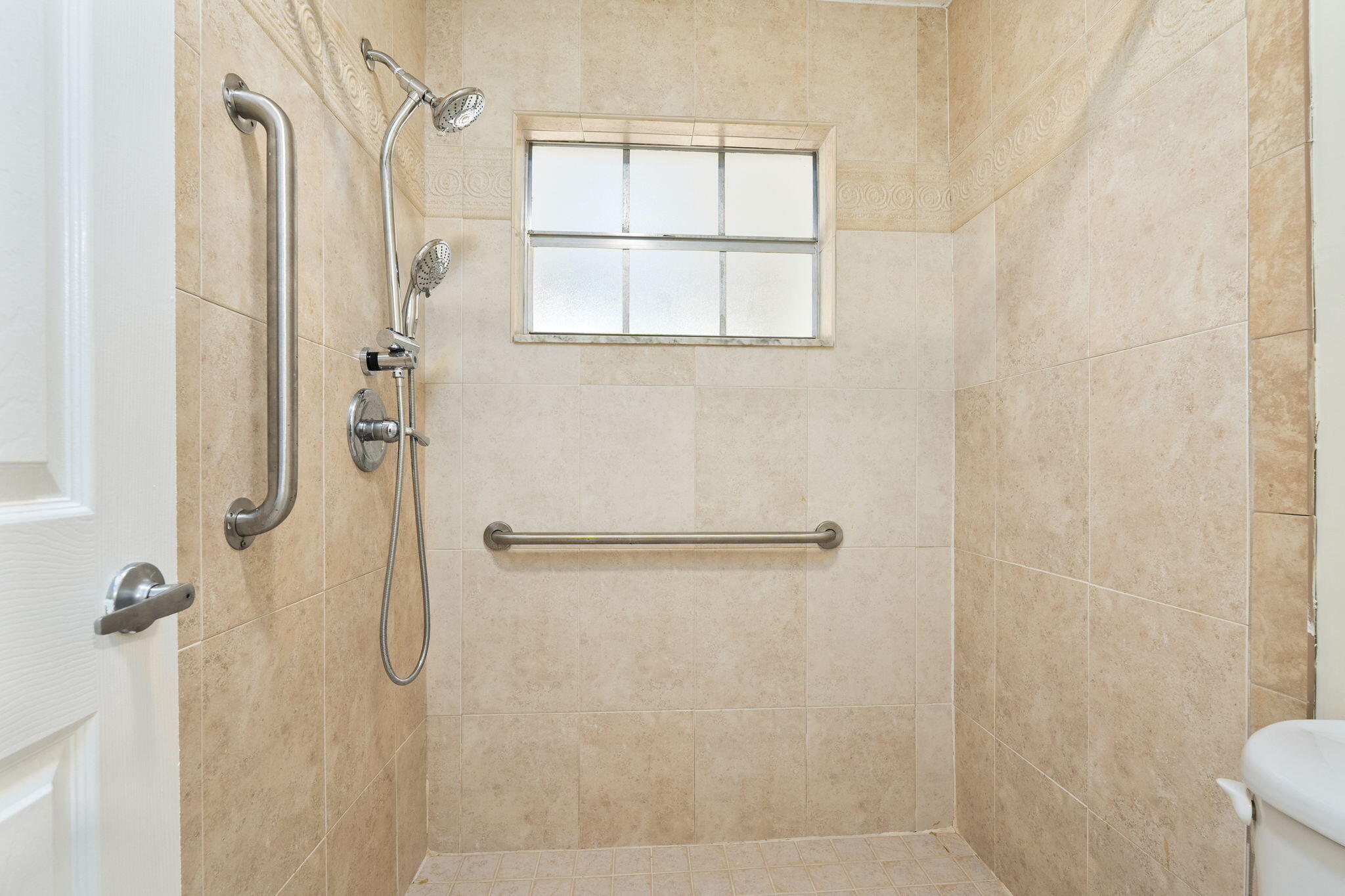 311 Colony Lane, Unit C Fort Pierce, FL 34982 - Photo 14 of 24 a bathroom with a shower
