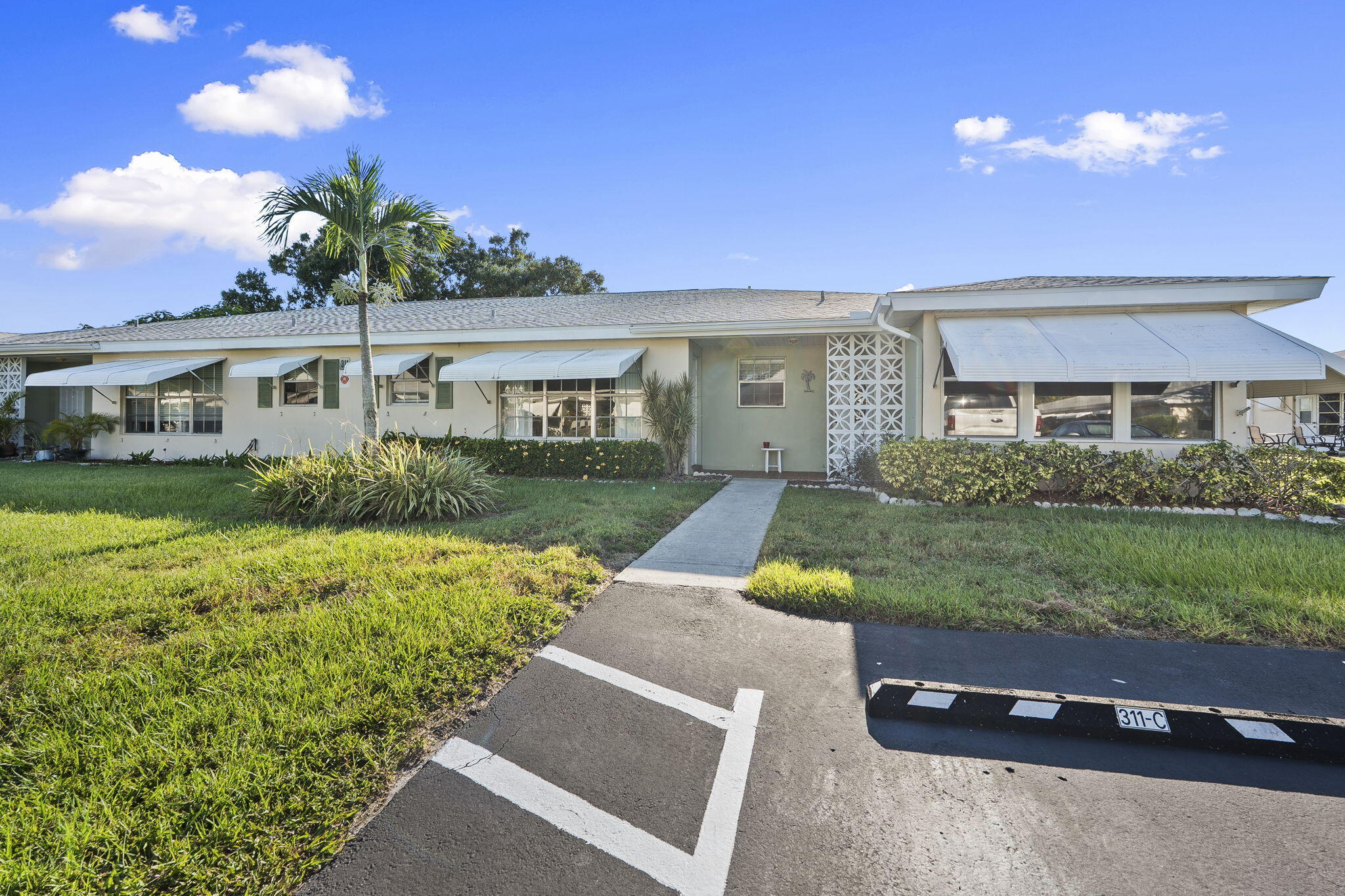 311 Colony Lane, Unit C Fort Pierce, FL 34982 - Photo 19 of 24 front view of house with a yard