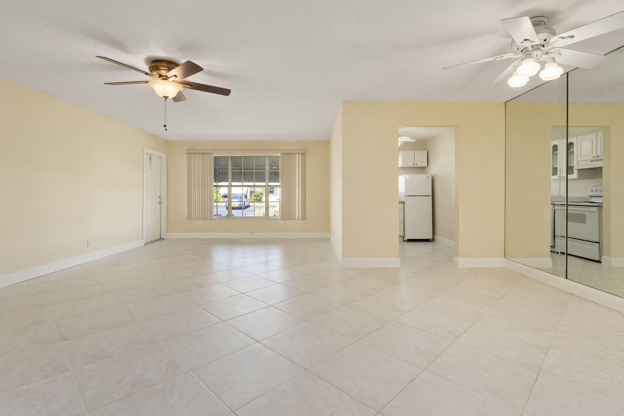 311 Colony Lane, Unit C Fort Pierce, FL 34982 - Photo 2 of 24 a view of an empty room with a window