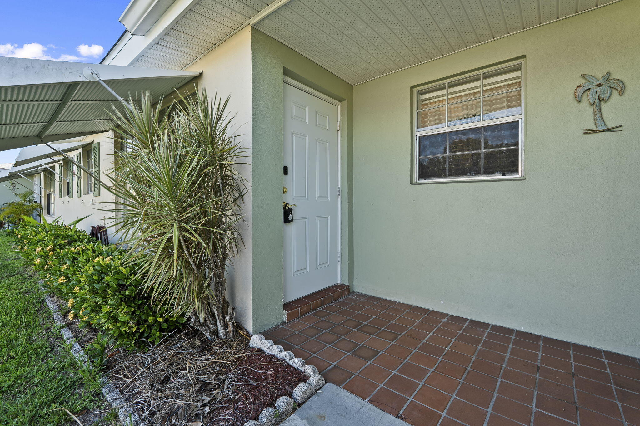 311 Colony Lane, Unit C Fort Pierce, FL 34982 - Photo 21 of 24 a view of a backyard of the house
