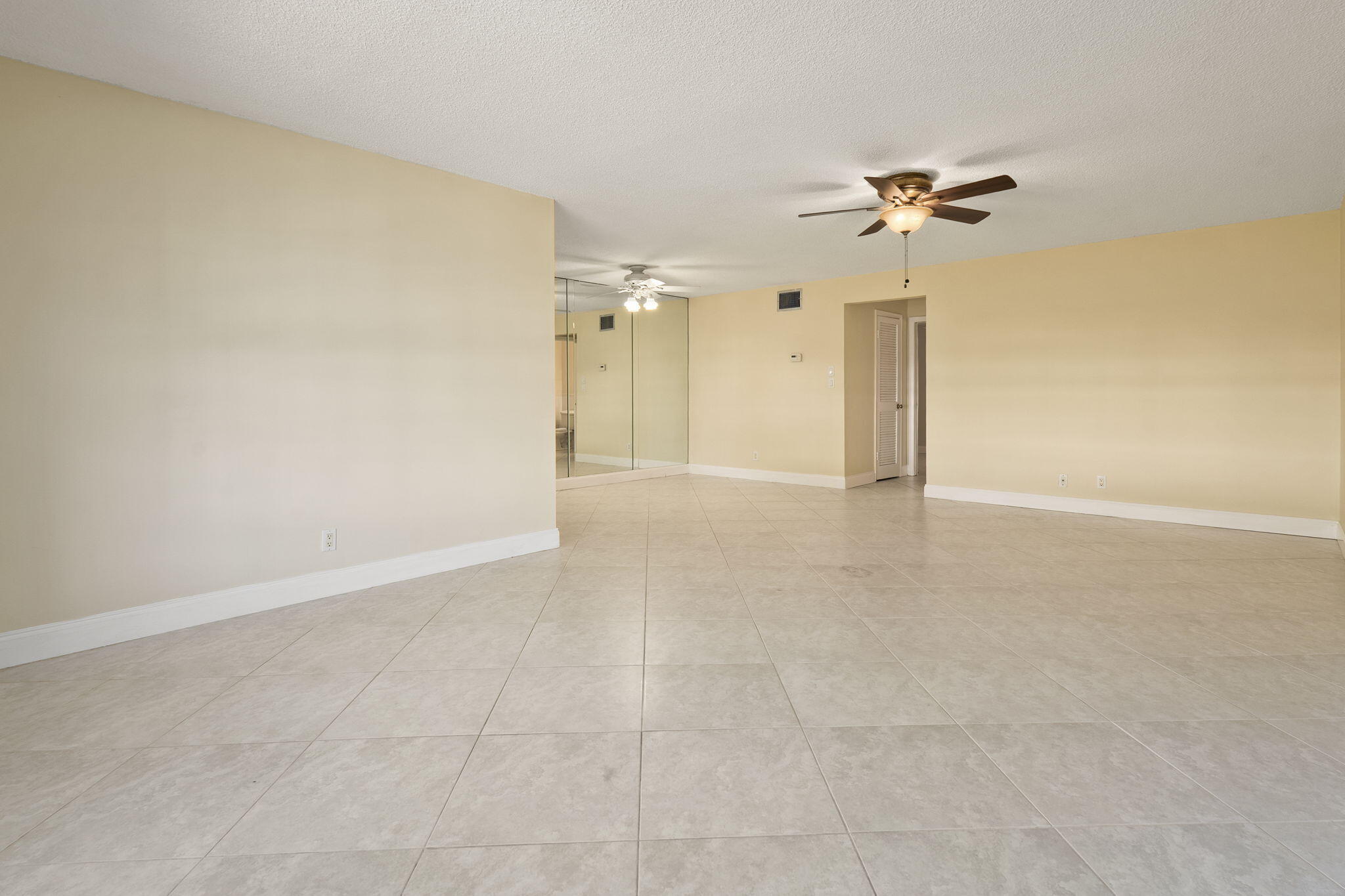 311 Colony Lane, Unit C Fort Pierce, FL 34982 - Photo 3 of 24 a view of a room with a ceiling fan