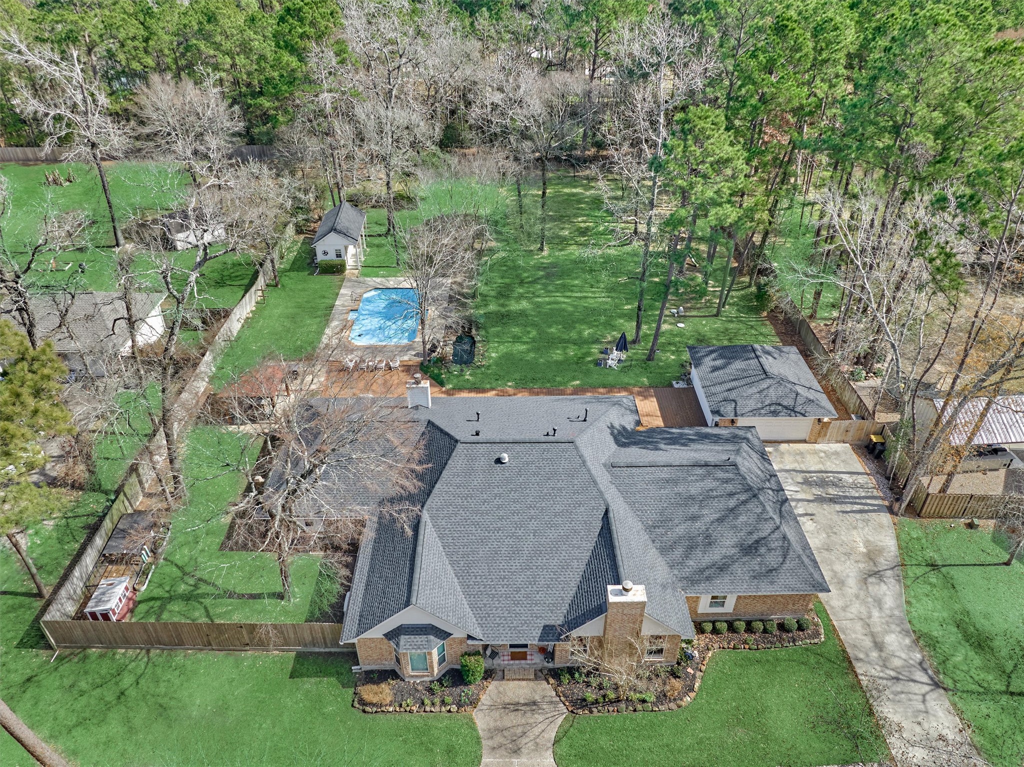 WOW! Lake Creek Forest beauty with NEW ROOF situated on a sprawling, wooded lot, lined with fruit trees and blackberry bushes.