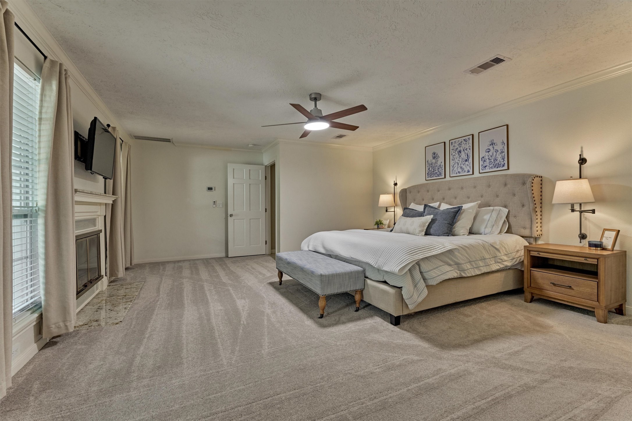 8 Wind River Court Conroe, TX 77384 - Photo 14 of 50 Spacious primary is a secluded retreat featuring private access to the rear patio area. Upgraded ceiling fans have been added throughout this home.