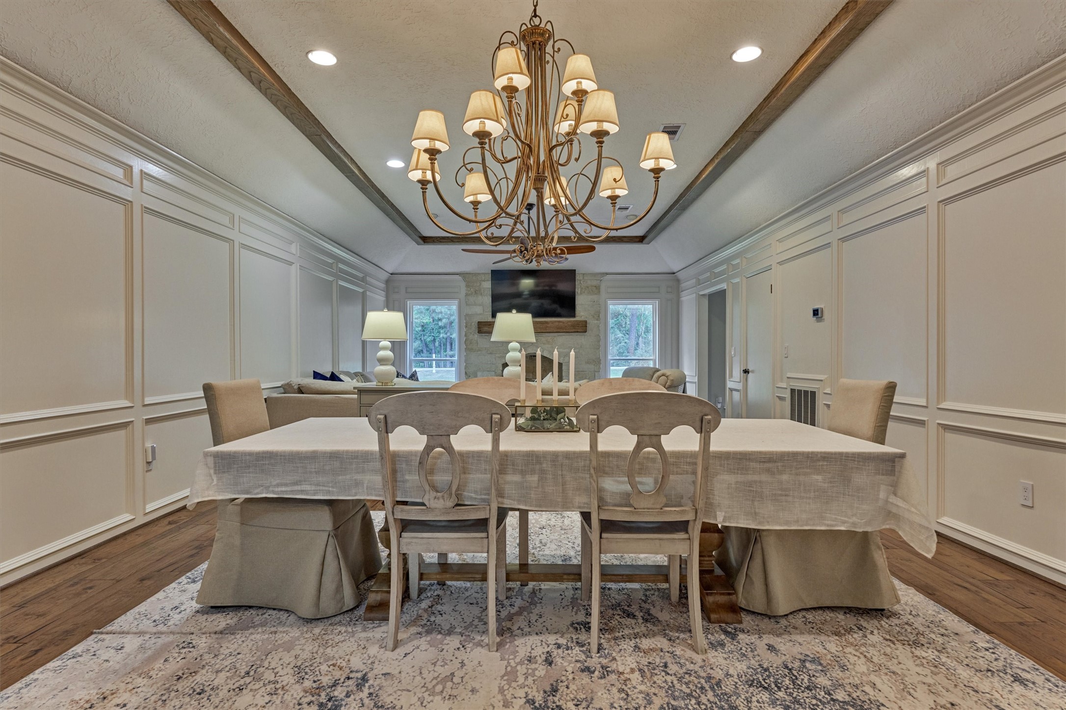 8 Wind River Court Conroe, TX 77384 - Photo 18 of 50 Striking dining room with grand chandelier is the ideal spot to host family gatherings!