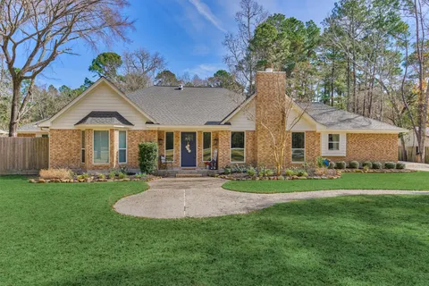 a front view of a house with a garden and porch