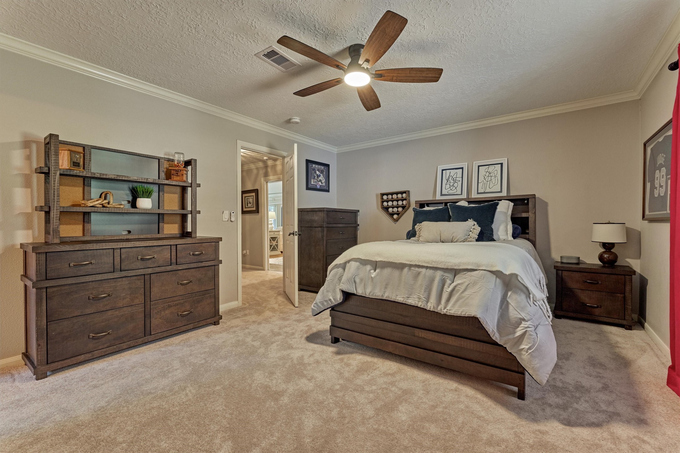 8 Wind River Court Conroe, TX 77384 - Photo 25 of 50 Note the continuous crown molding, fresh carpet and upgraded ceiling fan.
