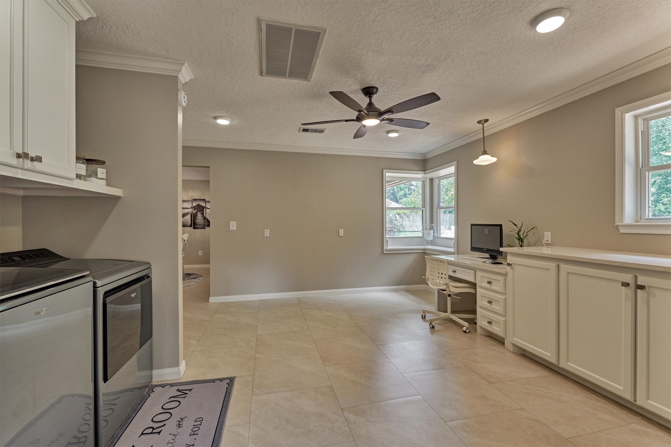8 Wind River Court Conroe, TX 77384 - Photo 30 of 50 Utility nook with bonus cabinetry/shelving for storage.