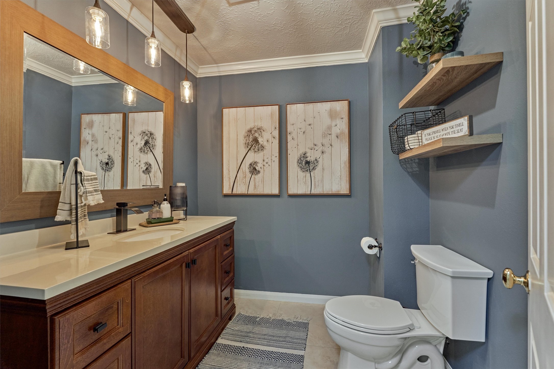 8 Wind River Court Conroe, TX 77384 - Photo 32 of 50 Powder bath sits at the rear of the home off the mudroom and easily doubles as the pool bathroom.