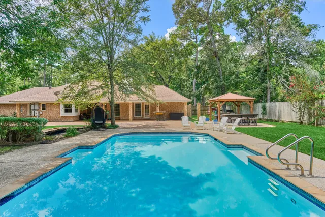 a view of a backyard with a small cabin