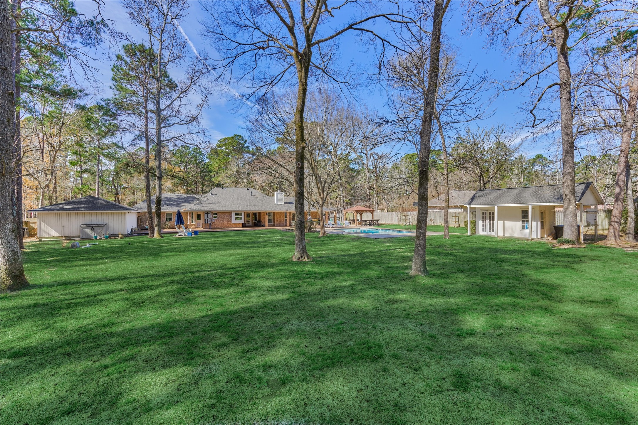 8 Wind River Court Conroe, TX 77384 - Photo 39 of 50 The opportunities are endless in this expansive backyard oasis!