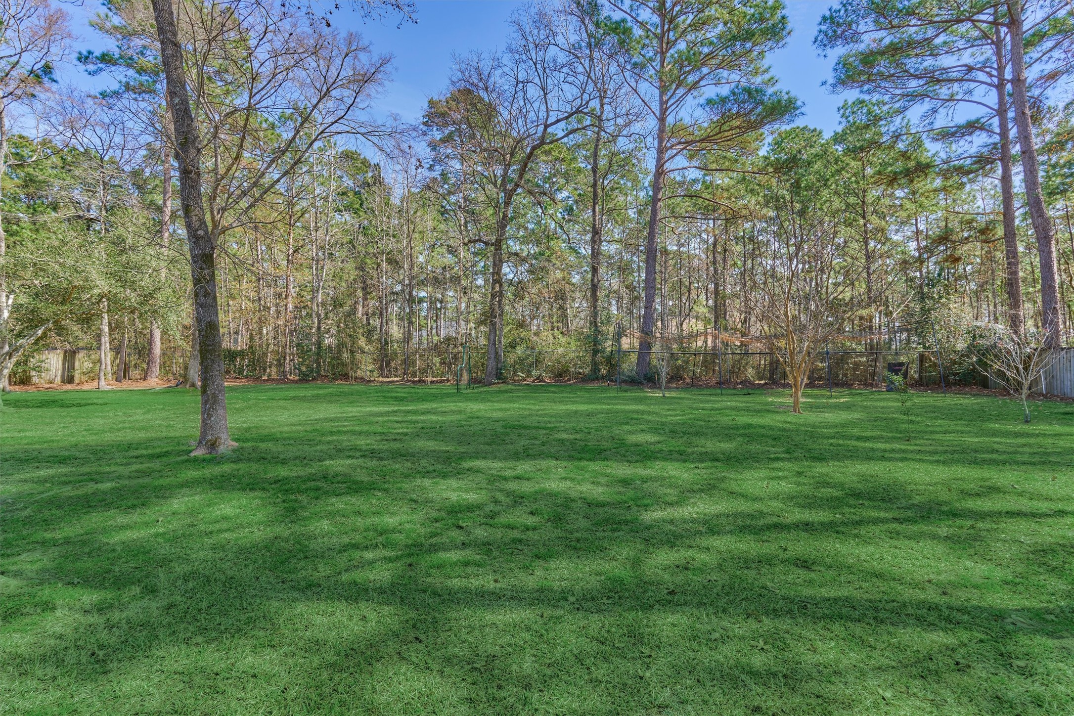 8 Wind River Court Conroe, TX 77384 - Photo 40 of 50 This yard is massive! Enjoy s'mores by the fire on those crisp fall evenings!