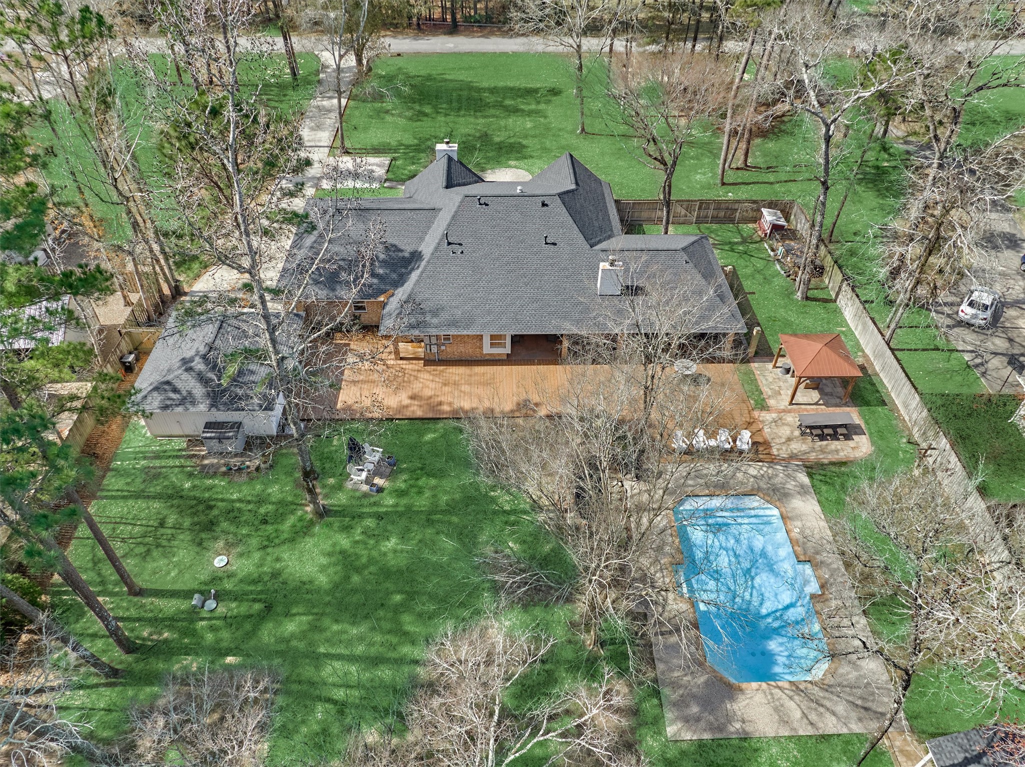 8 Wind River Court Conroe, TX 77384 - Photo 43 of 50 Aerial view of the rear of the property.