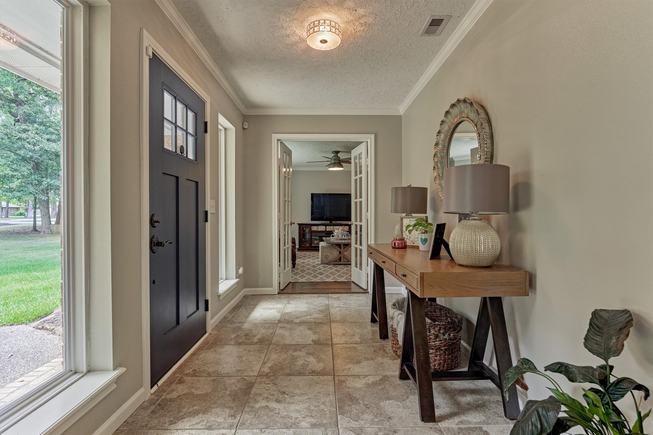 8 Wind River Court Conroe, TX 77384 - Photo 5 of 50 Note the continuous crown molding throughout this gorgeous property! Foyer opens to the family room (optional home office).