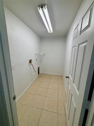 a view of a room with white walls