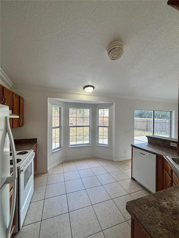 6605 Southwest 129th Loop Ocala, FL 34473 - Photo 7 of 21 a kitchen with granite countertop a stove a sink and a granite counter tops