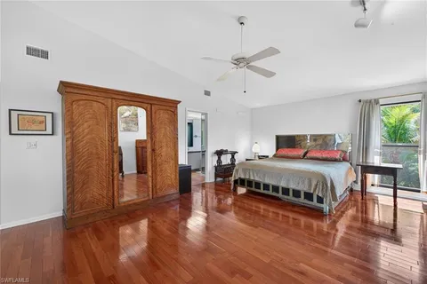 a bathroom with a granite countertop sink mirror and toilet